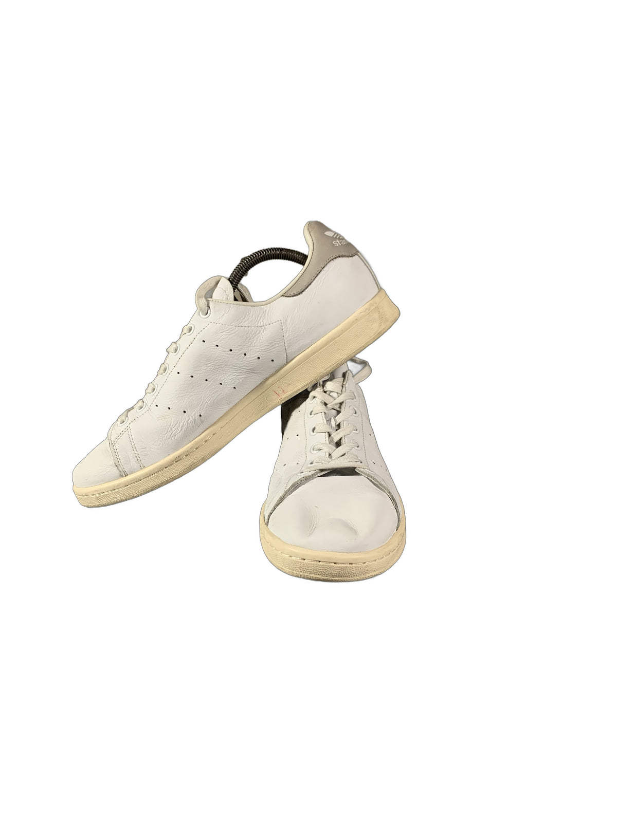 Adidas Stan Smith sneaker features a clean white leather