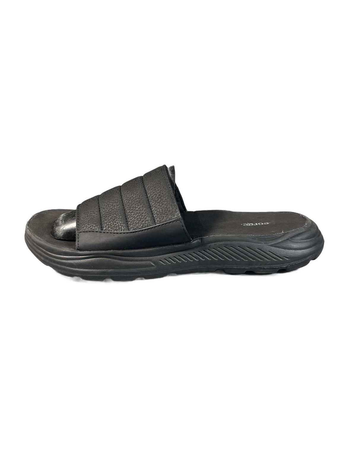 Black quilted slide sandal with a curved comfort sole