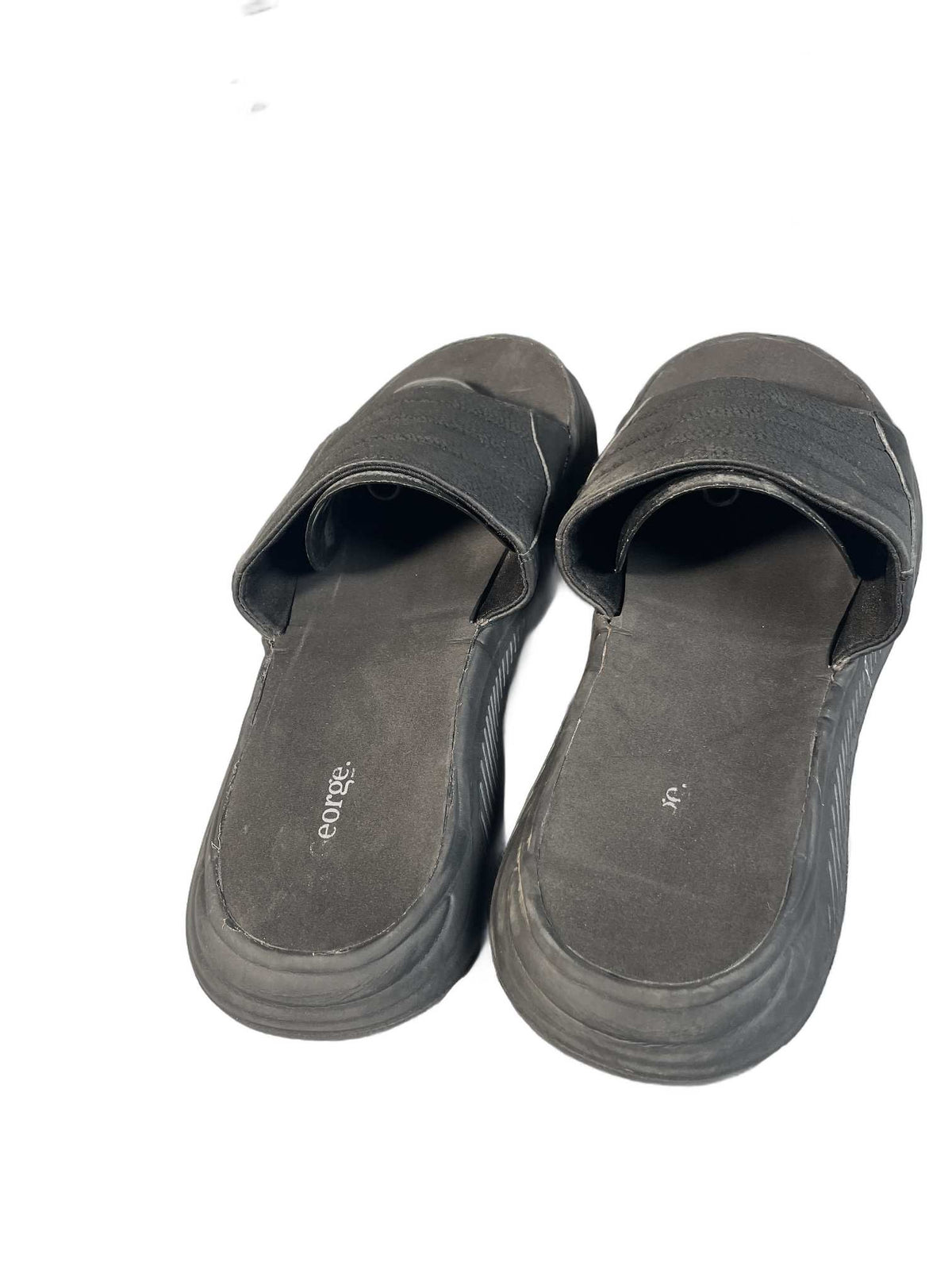 Black quilted slide sandal with a curved comfort sole