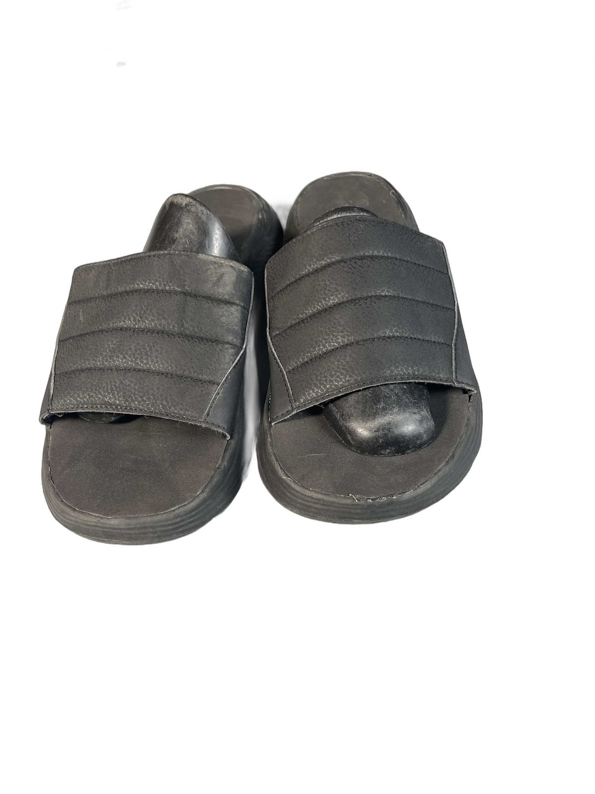 Black quilted slide sandal with a curved comfort sole