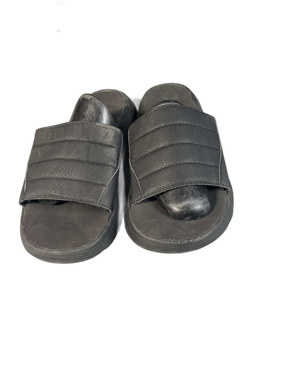 Black quilted slide sandal with a curved comfort sole