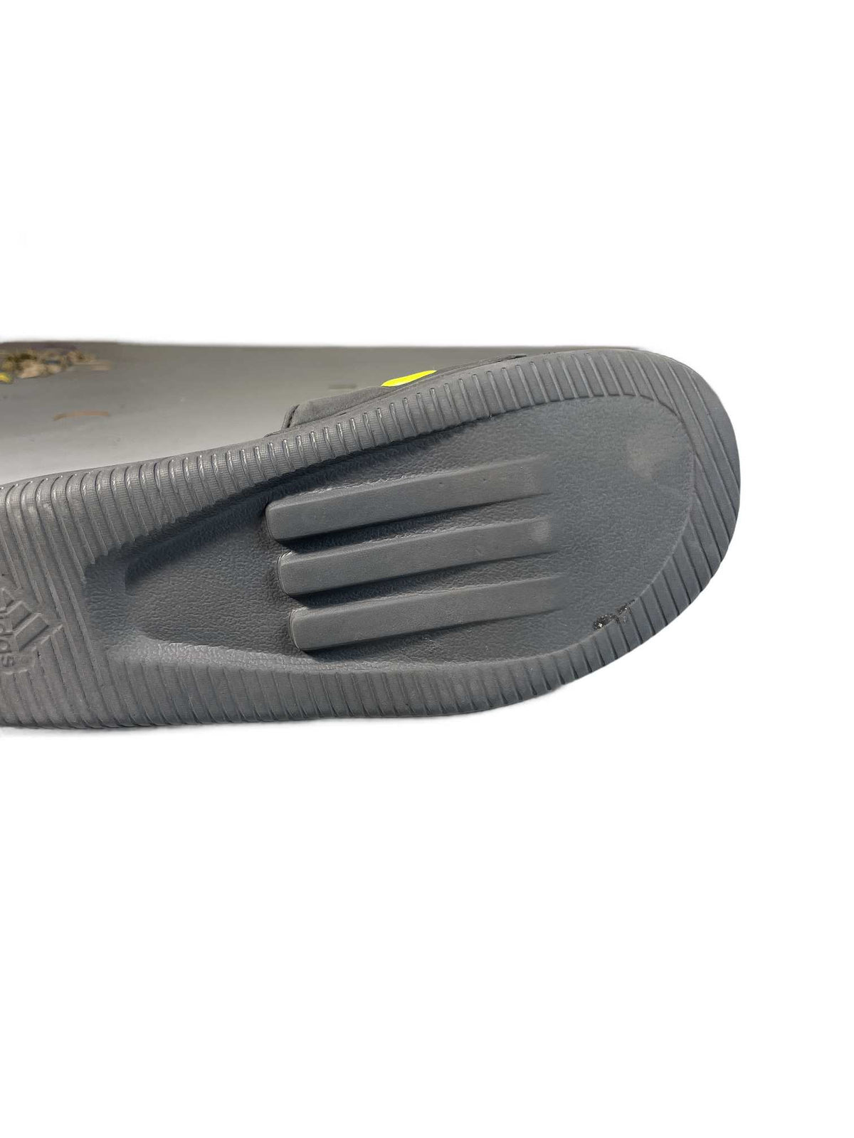 Black and neon-yellow Adidas recovery/shower slide