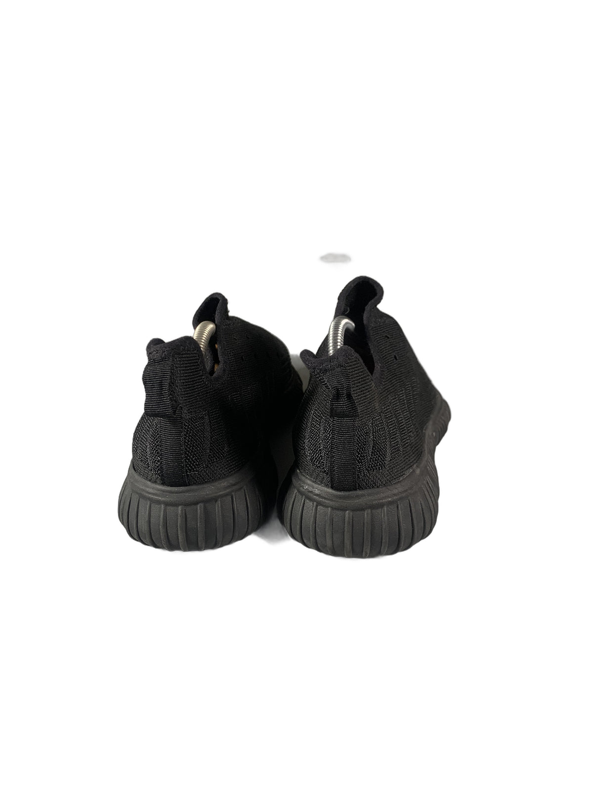 black slip-on knit sneaker with a grooved rubber sole shoe