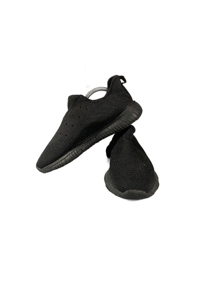 black slip-on knit sneaker with a grooved rubber sole shoe