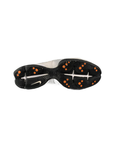 Nike athletic shoe in a white and orange