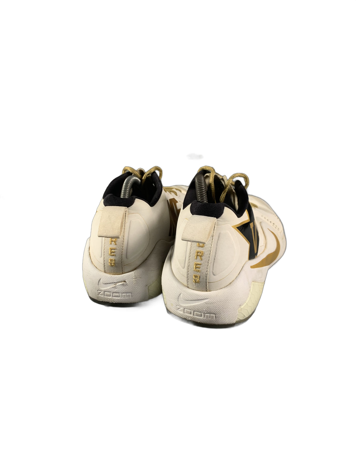 Nike  white and gold athletic shoe